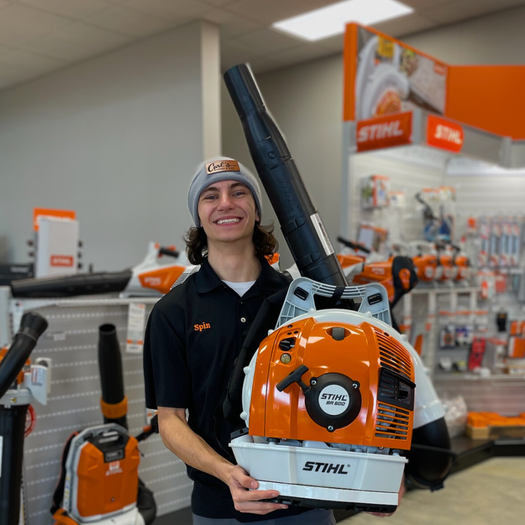Spin smiling and holding a STIHL BR 600 backpack blower