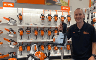 Image of man holding STIHL chainsaw